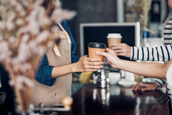 Barista-served-take-away-hot-coffee-cup-to-customer-at-counter-bar-in-cafe-restaurant,coffee-shop-business-owner-concept